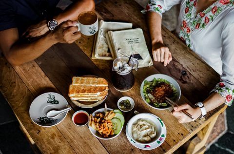 Eating traditional dishes in Ipoh, Malaysia