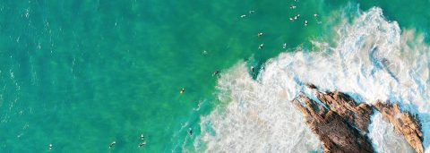 aerial image of waves on coastline