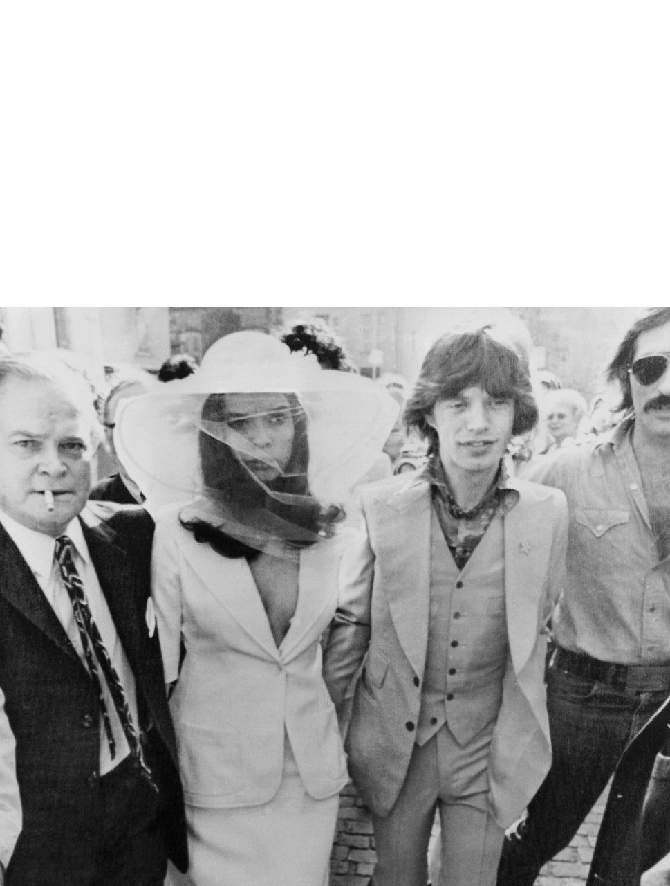 Bianca Jagger wore a white Le Smoking design to wed Mick in 1971 in St Tropez