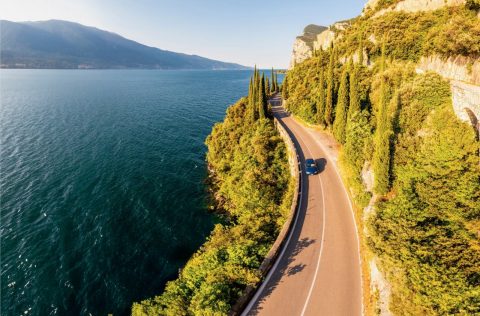 Car driving down the coast of Italy